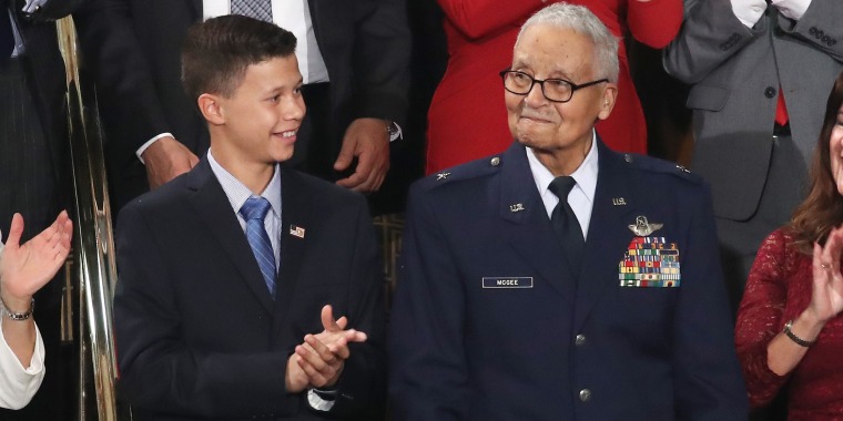 Retired Brigadier General Charles McGee, right, who served with the Tuskegee Airmen, attends the State of the Union address with his great-grandson Iain Lanphier on Tuesday in Washington.