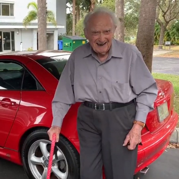 Joe Newman and his red Mercedes, which he still drives