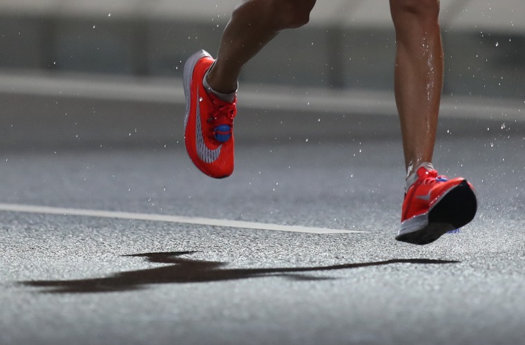 Image: A runner wears Nike Vaporfly  sneakers during the World Athletics Championships