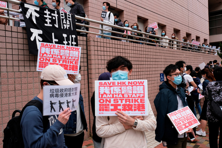 Image: Medical workers hold a strike the outside Hospital Authority as they demand for Hong Kong to close its border with China to reduce the coronavirus spreading