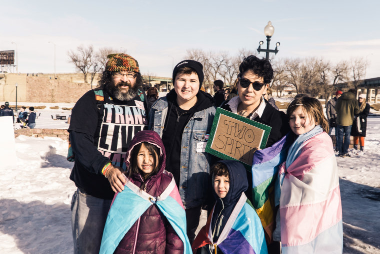 Dylan Daniels, second from left, and his dad, left, with members of their family at the march.