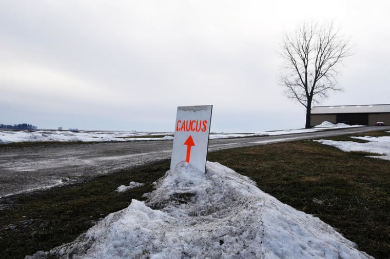 A sign directs caucus goers to the home of Gary and Mary Weaver in Rippey, Iowa