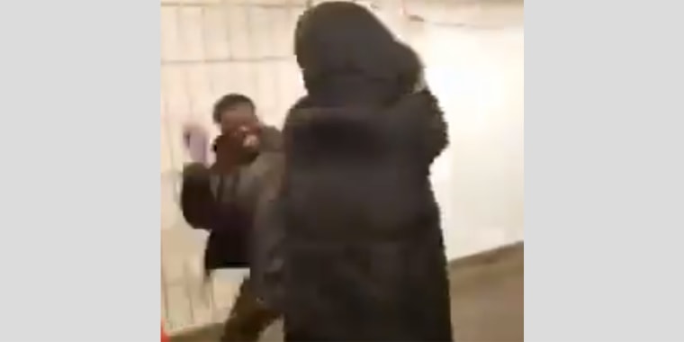 A man attacks a woman wearing a face mask in the New York City subway.