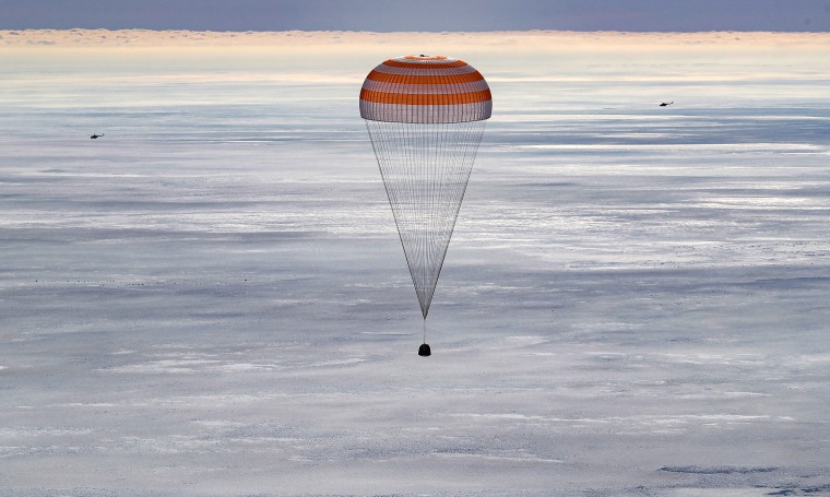 Image: The Russian Soyuz MS-13 space capsule descends to earth in Kazakhstan on Feb. 6, 2020.