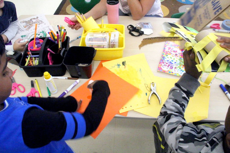 Students in Sara Stevens' kindergarten class make colorful masks during "Play to Learn" time.