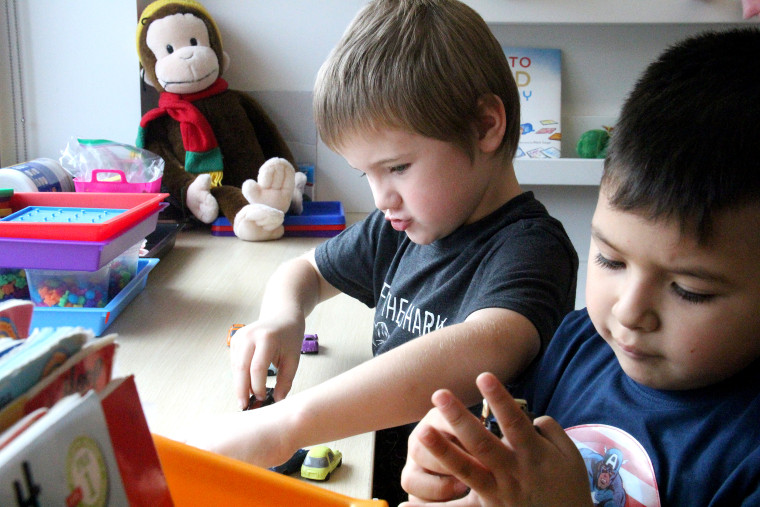 Students play with cars during "Play to Learn" time. Washington is one of several states encouraging districts to include more time for play during full-day kindergarten programs.