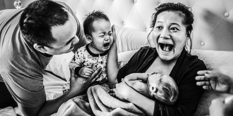 The faces in this award-winning birth photo by Florida photographer Paulina Splechta get us every time.
