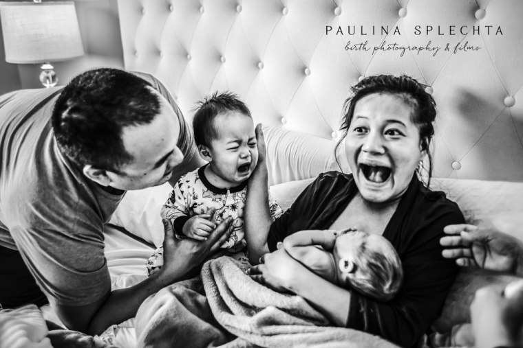 This image by Florida photographer Paulina Splechta captures a big brother meeting his baby sister, and realizing he is no longer the baby of the family.