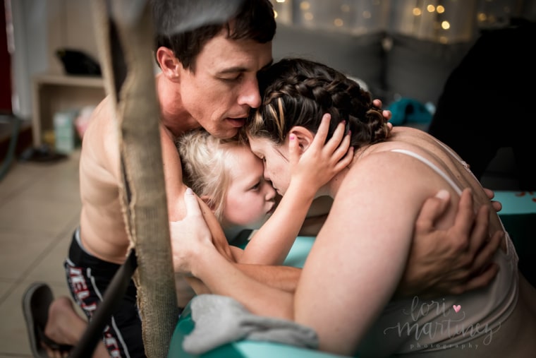5-year-old Piper stayed by her mother, Ashley Shaffer's, side throughout her home birth. Photographer Lori Martinez says Piper was "a total doula to her mama."