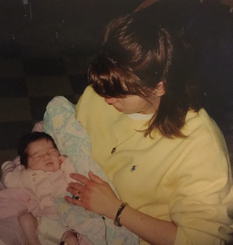 Rebecca Slama holding her daughter, Rylie, who was diagnosed with hypoplastic left heart syndrome the day after her birth.