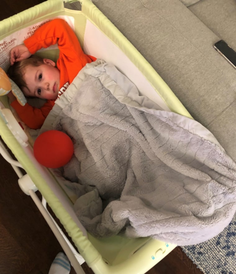 Calvin hopped into Oliver's bassinet for a little baby time of his own.