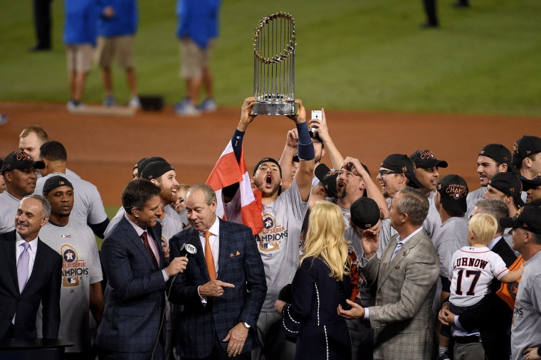 Image: Carlos Correa of the Houston Astros hoists the trophy after defeating the Los Angeles Dodgers to win the 2017 World Series at Dodger Stadium on November 1, 2017 in Los Angeles.