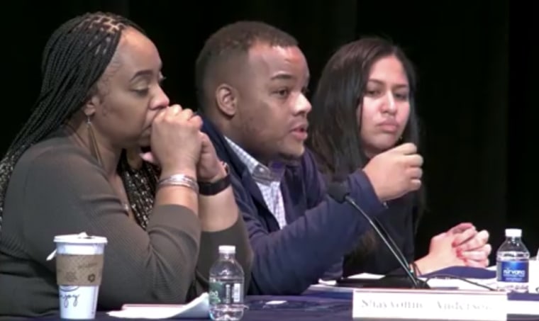 Image: Reggie Bledsoe, center, at a meeting of the Newark Board of Education in Newark New Jersey.