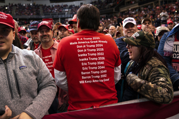 A supporter of President Donald Trump wears a shirt promoting future presidential runs by Trump's children at a rally on Feb. 10, 2020, in Manchester, N.H.