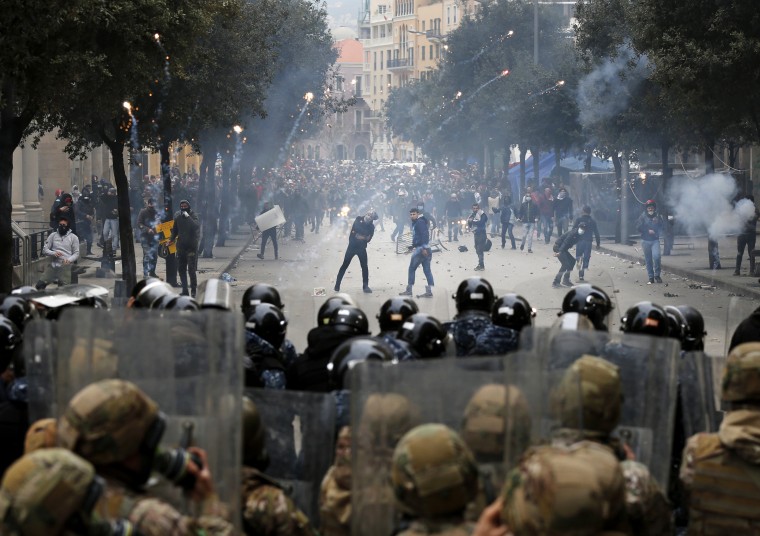 Image: Police fire tear gas at anti-government protesters in Beirut, Lebanon, on Feb. 11, 2020.