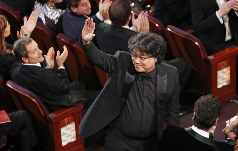 Bong Joon-ho wins the Oscar for Best Original Screenplay for \"Parasite\" at the 92nd Academy Awards on Feb. 9, 2020.