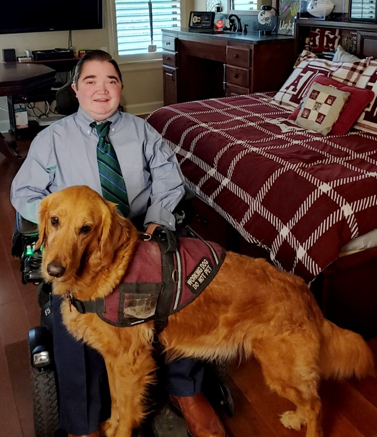 Image: Kyle Cox with his service dog, Amber.