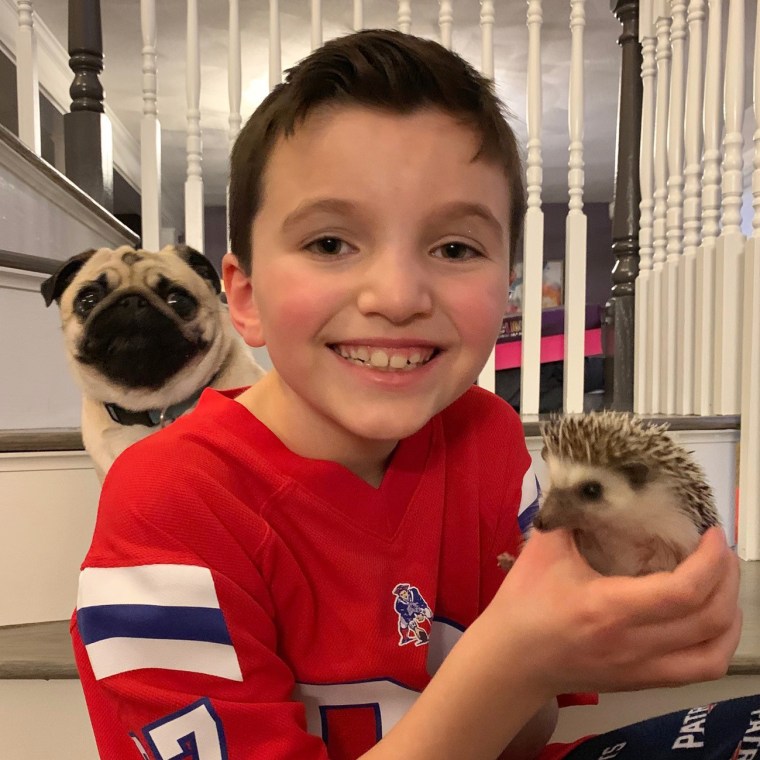 Jacob with his hedgehog, Trinket, and his pug, Luna