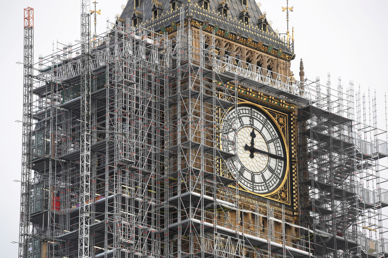Image: The Elizabeth Tower, housing the Big Ben bell, is seen clad in scaffolding, over the Houses of Parliament, in central London.
