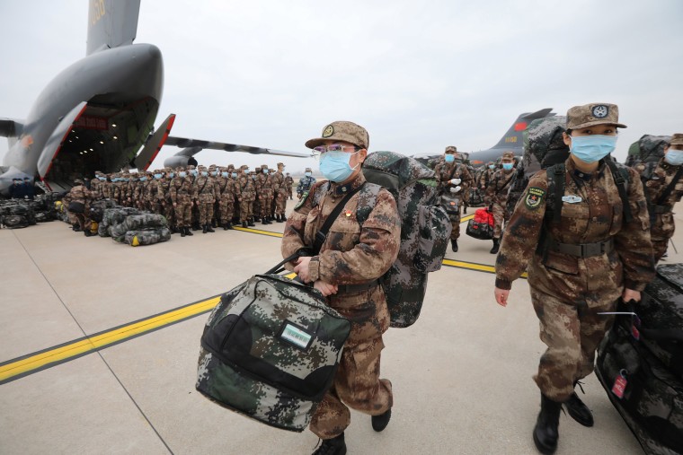 Image: Medical personnel arrive with medical supplies in transport aircraft of the Chinese People's Liberation Army Air Force at the Wuhan Tianhe International Airport following the outbreak of the novel coronavirus in Wuhan, Hubei province, Chin