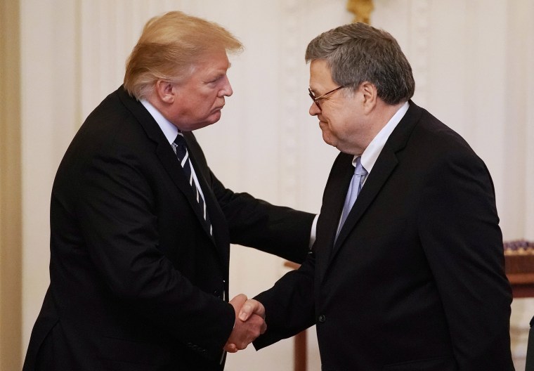 Image: President Donald Trump shakes hands with Attorney General William Barr in the East Room of the White House