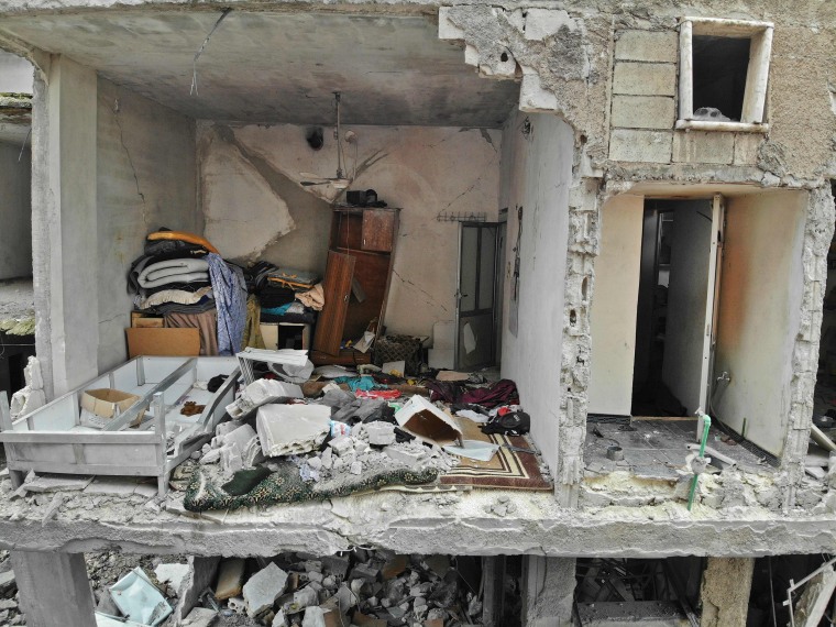 Image: A destroyed building in the town of Taftanaz, northeast of Idlib on Thursday.
