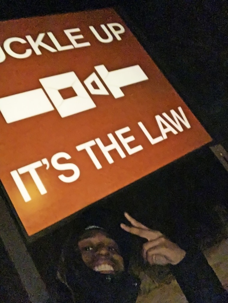 One of Jaylan's coaches asked if he would take a photo of a roadside sign for the team's social media account. Jaylan took the photo and began walking back to the bus.