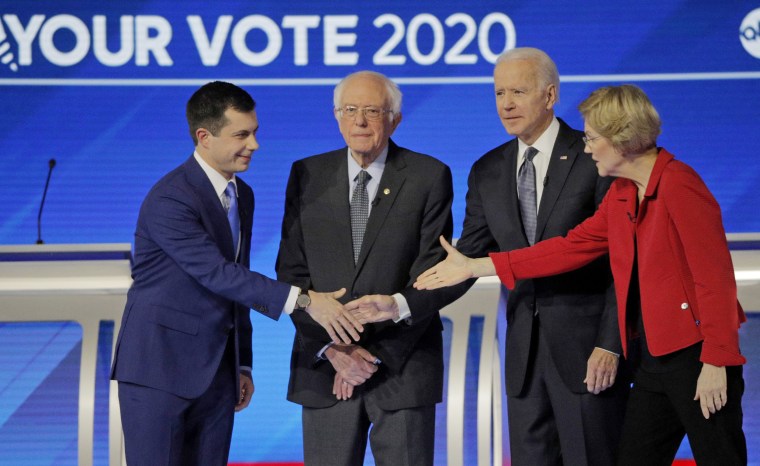 Image: Democratic 2020 U.S. presidential candidates pose together before the start of their debate in Manchester, New Hampshire, U.S.