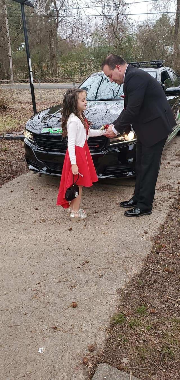 School resource officer Nicol "Nick" Harvey took Avey Cox to the father-daughter dance after her father passed away. 