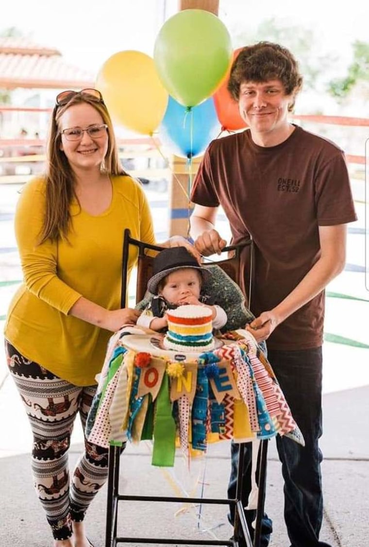 Demi Garza-Pena and her husband, Don, with Oliver on his first birthday.