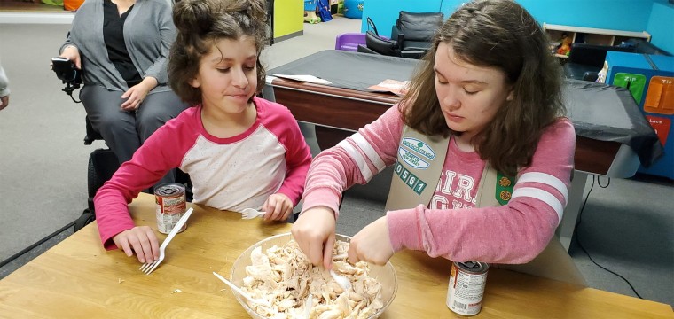 Learning how to cook, make pet beds, go to the grocery store or exchange money boosts the confidence of members of Girl Scout troop 60561. 