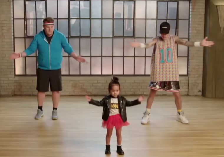 James Corden and Justin Bieber do their best to keep up with their tiny instructor.