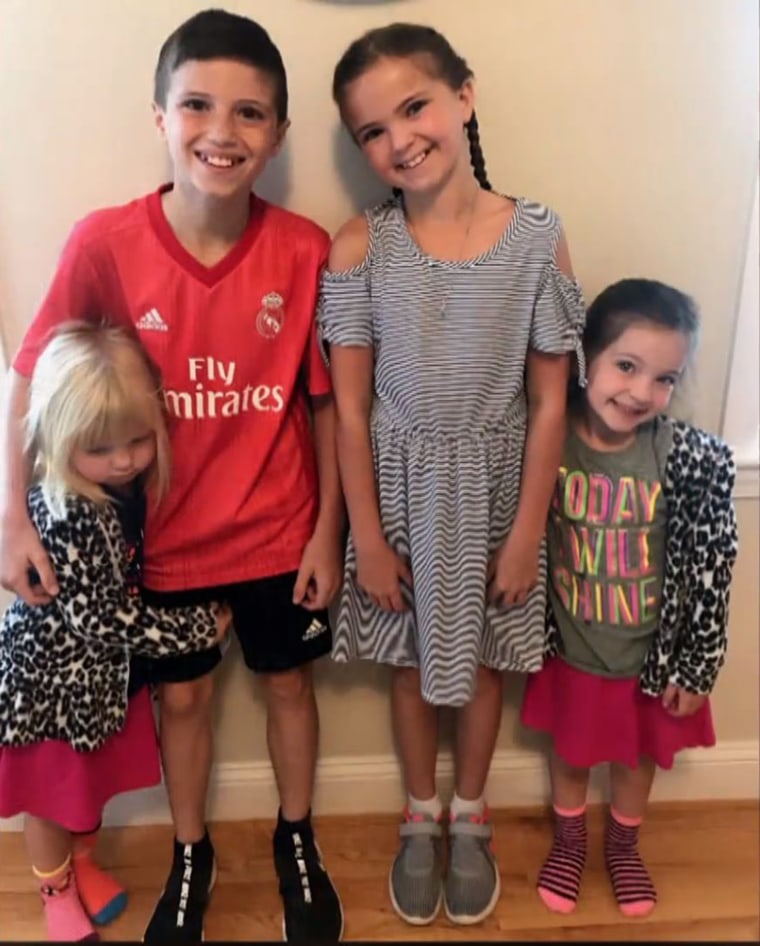 Two of the family's four children, Skylar Smith (far left), 5, and Shalie Smith, 10, (in dress) survived with minor injuries, while their two siblings were killed in the crash. 