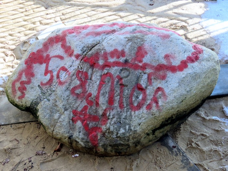 Plymouth Rock was spray-painted with a message Monday as one or more vandals struck the historic site in Plymouth, Mass.