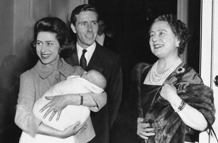 Queen Mother Elizabeth says goodbye to her daughter, Princess Margaret, and her son-in-law, Lord Snowdon, as they leave Clarence House in London on Nov. 30, 1961 with their infant son, Viscount Linley.