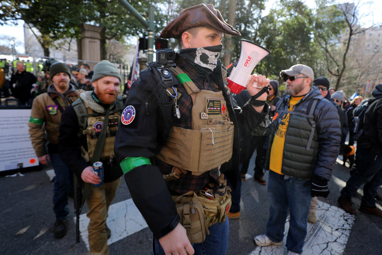 Image: Gun rights advocates wearing body armor and carrying firearms leave a rally organized by The Virginia Citizens Defense League near the State Capitol Building Jan. 20, 2020 in Richmond, Virginia.