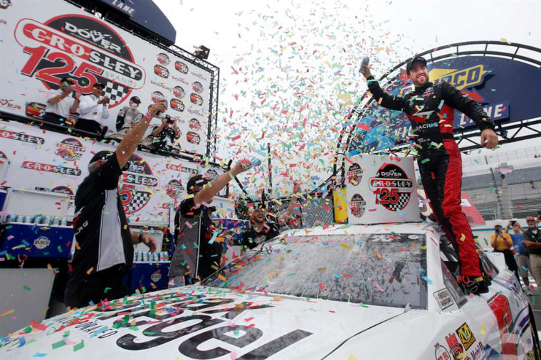 Image: Program alumni, Ruben Garcia Jr., celebrates with No. 6 Max Siegel Inc. Toyota car in the victory lane at Dover International Speedway.