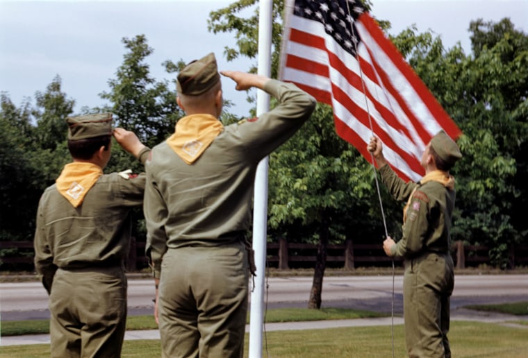 Image: Boy Scouts salute the American flag in 1959.