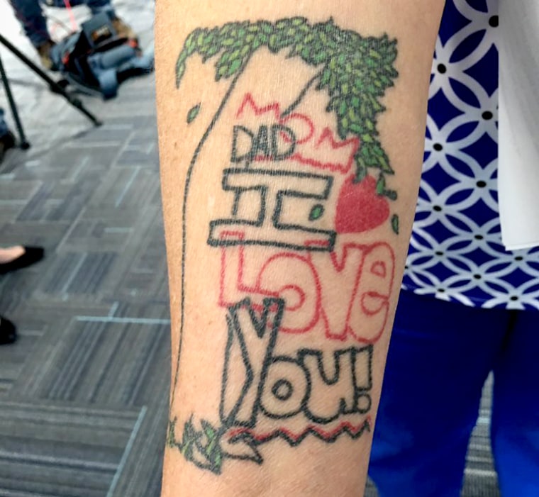 Tina Franke has a tattoo on her right arm of a doodle her daughter once drew that says "Mom Dad I love you."