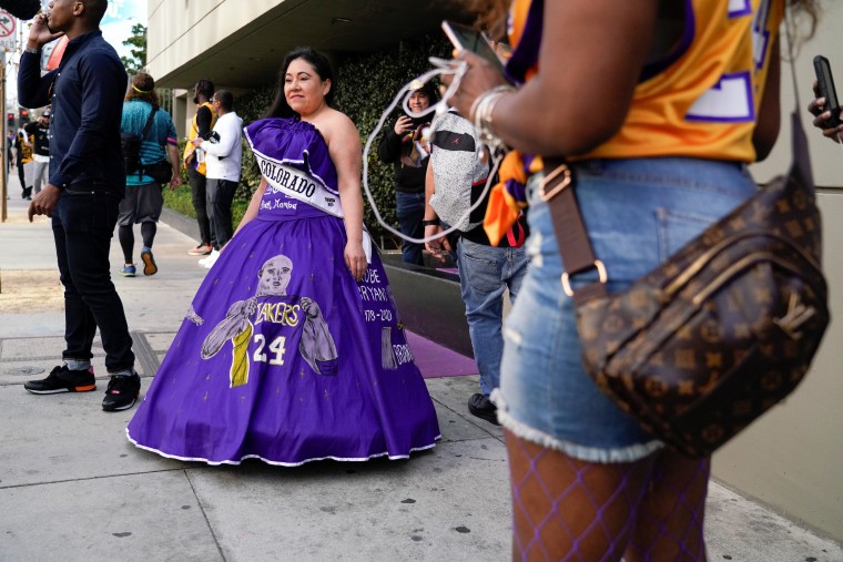 Image: Fans wait in line before the public memorial for NBA great Kobe Bryant, his daughter and seven others killed in a helicopter crash, at the Staples Center in Los Angeles