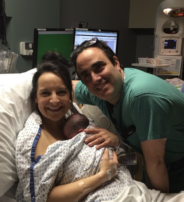 Dr. Eric Grossman posed with mom of eight Jamie Davidson shortly after she gave birth to Joelle, her second daughter born on leap day. 