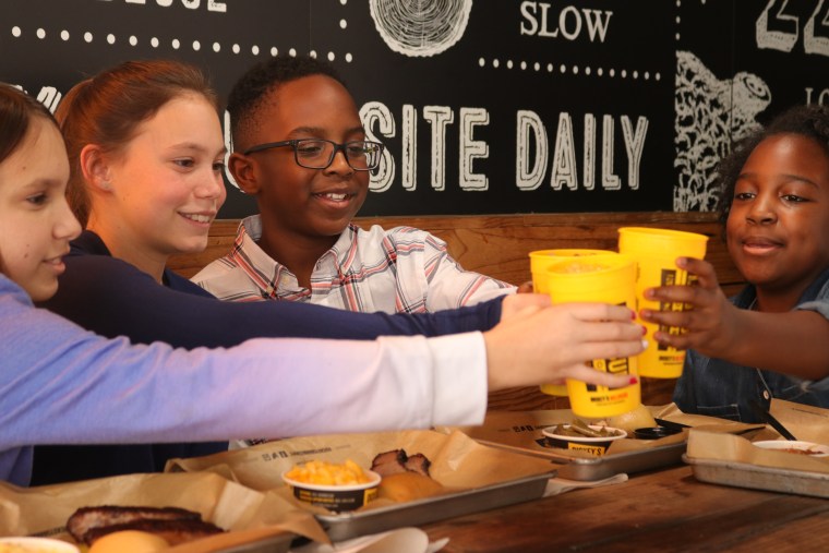 Kids eating at Dickey's Barbecue Pit on Kids Eat Free Night