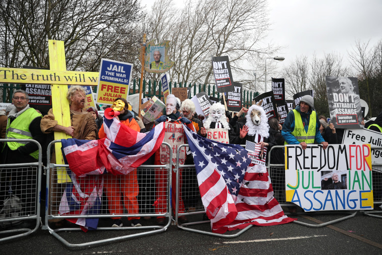 Image: Demonstrators hold signs behind a barricade in support of WikiLeaks founder Julian Assange, outside Woolwich Crown Court, ahead of a hearing to decide whether Assange should be extradited to the United States, in London,