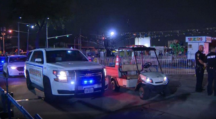 Image: Police at the scene where 7 people were shot at a flea market in Houston, TX.