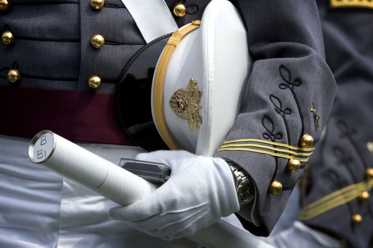 Image: A cadet holds his diploma at U.S. Military Academy Graduation at West Point in N.Y. in 2007.