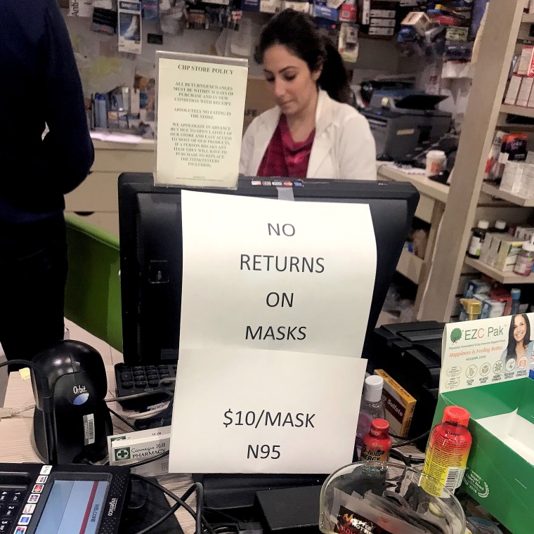 Image: A pharmacy displays a sign that there is no returns on N95 face masks in advance of the potential coronavirus outbreak in the Manhattan borough of New York City