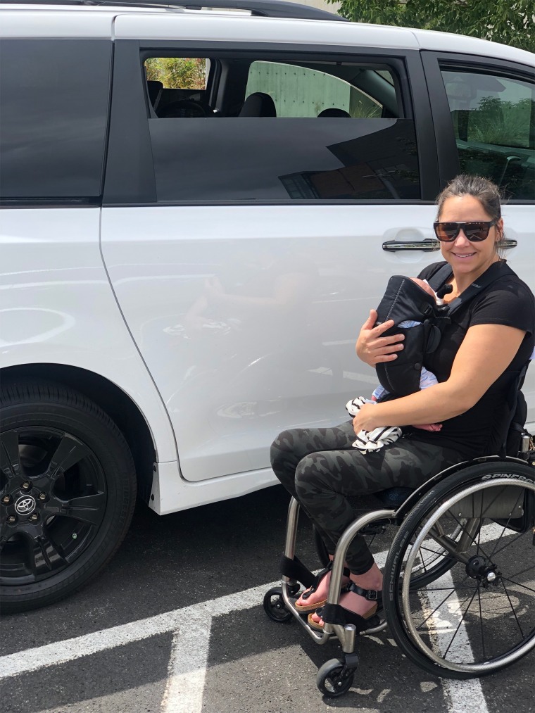 Mom and Paralympian Alana Nichols in a wheelchair outside her minivan