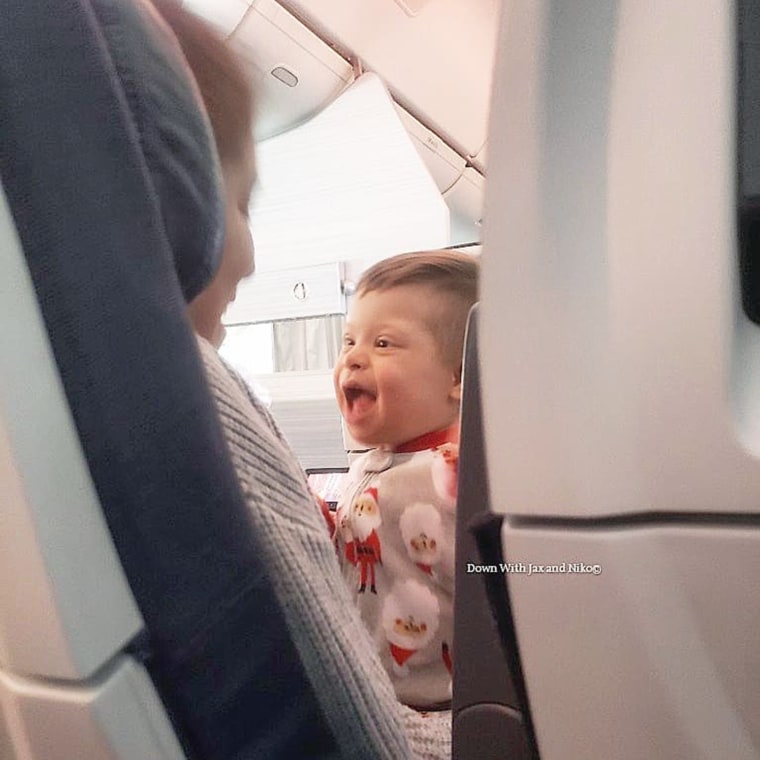 Niko, Graham's youngest son, was happy to be cuddled by the other mother for more than a half an hour on the plane. 