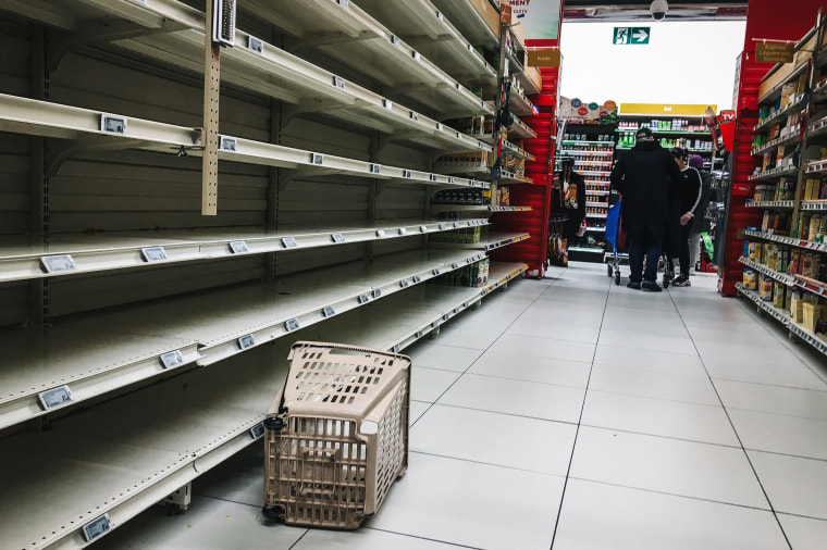 Image: Empty shelves in a supermarket in the Qwartz shopping centre in Villeneuve-la-Garenne, north of Paris