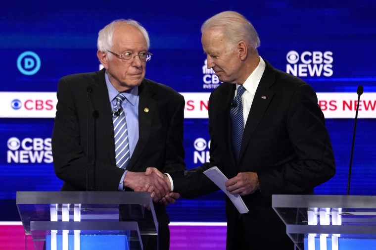 Image: Democratic 2020 U.S. presidential candidates Senator Bernie Sanders shakes hands with former Vice President Joe Biden after the tenth Democratic 2020 presidential debate at the Gaillard Center in Charleston, South Carolina